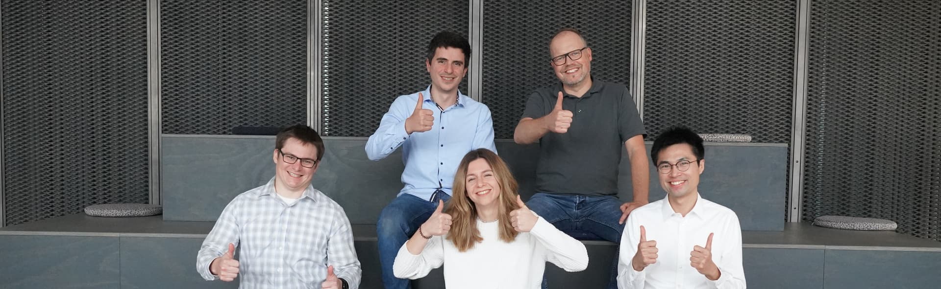 IUNA AI team giving thumbs up