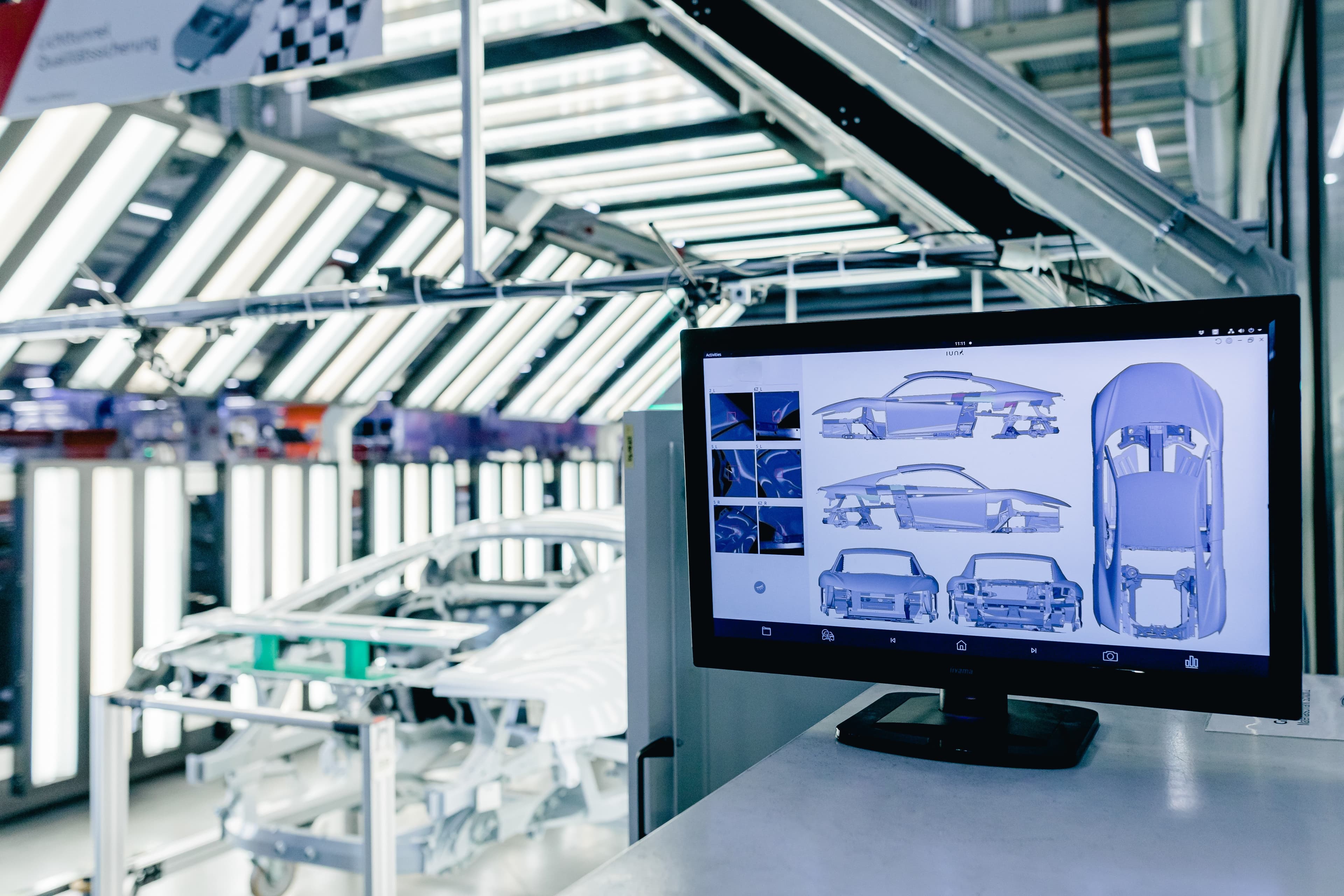 IUNA Auto Scanner v3 user interface showing body analysis in Audi production facility