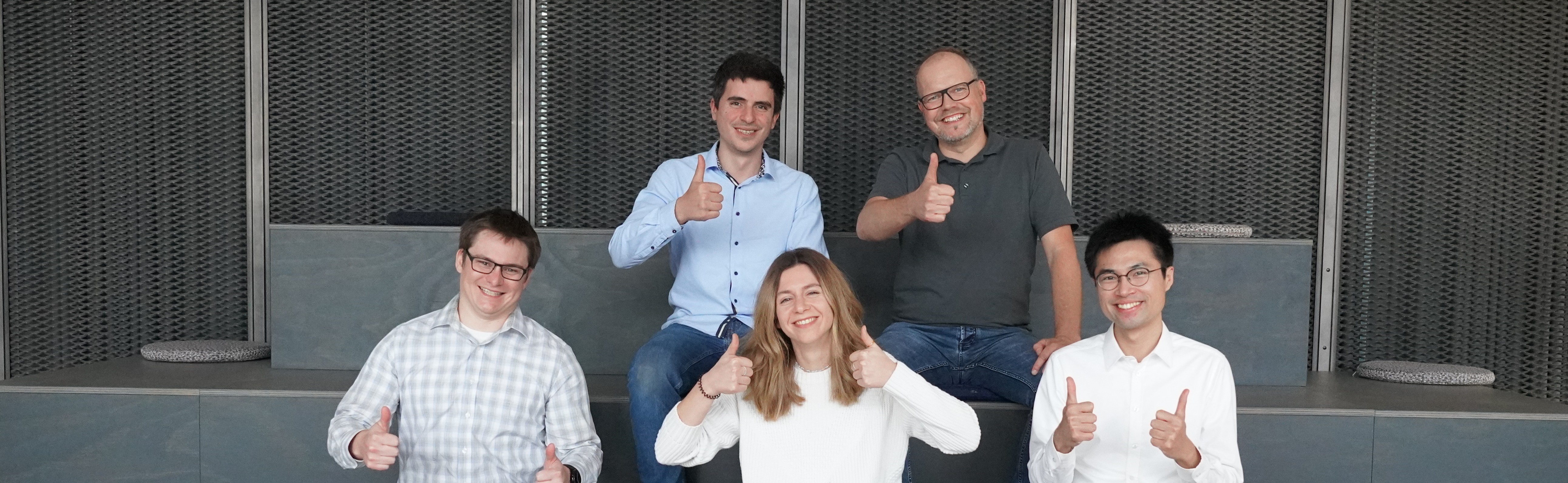 IUNA AI team giving thumbs up