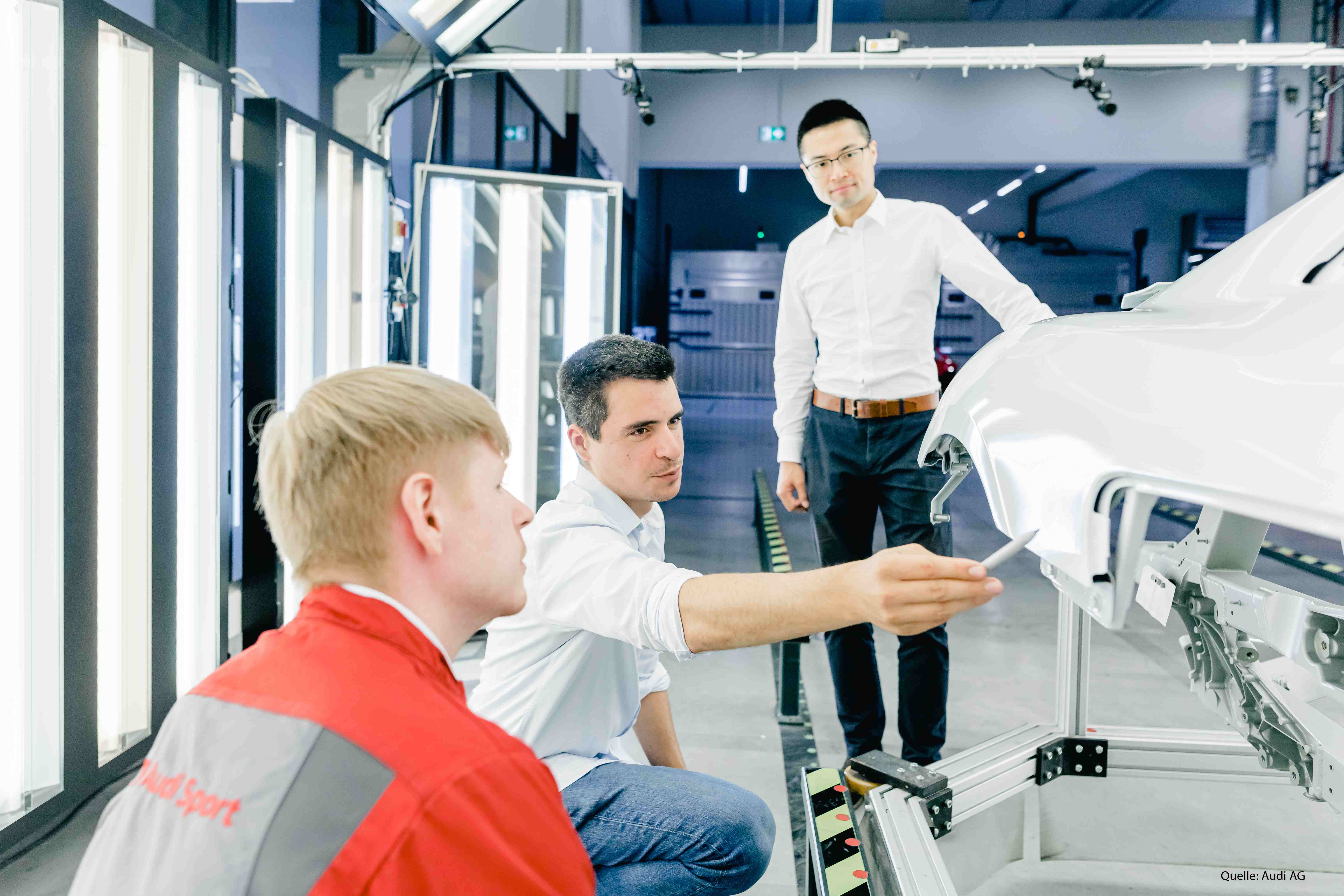 IUNA AI team inspecting components at Audi
