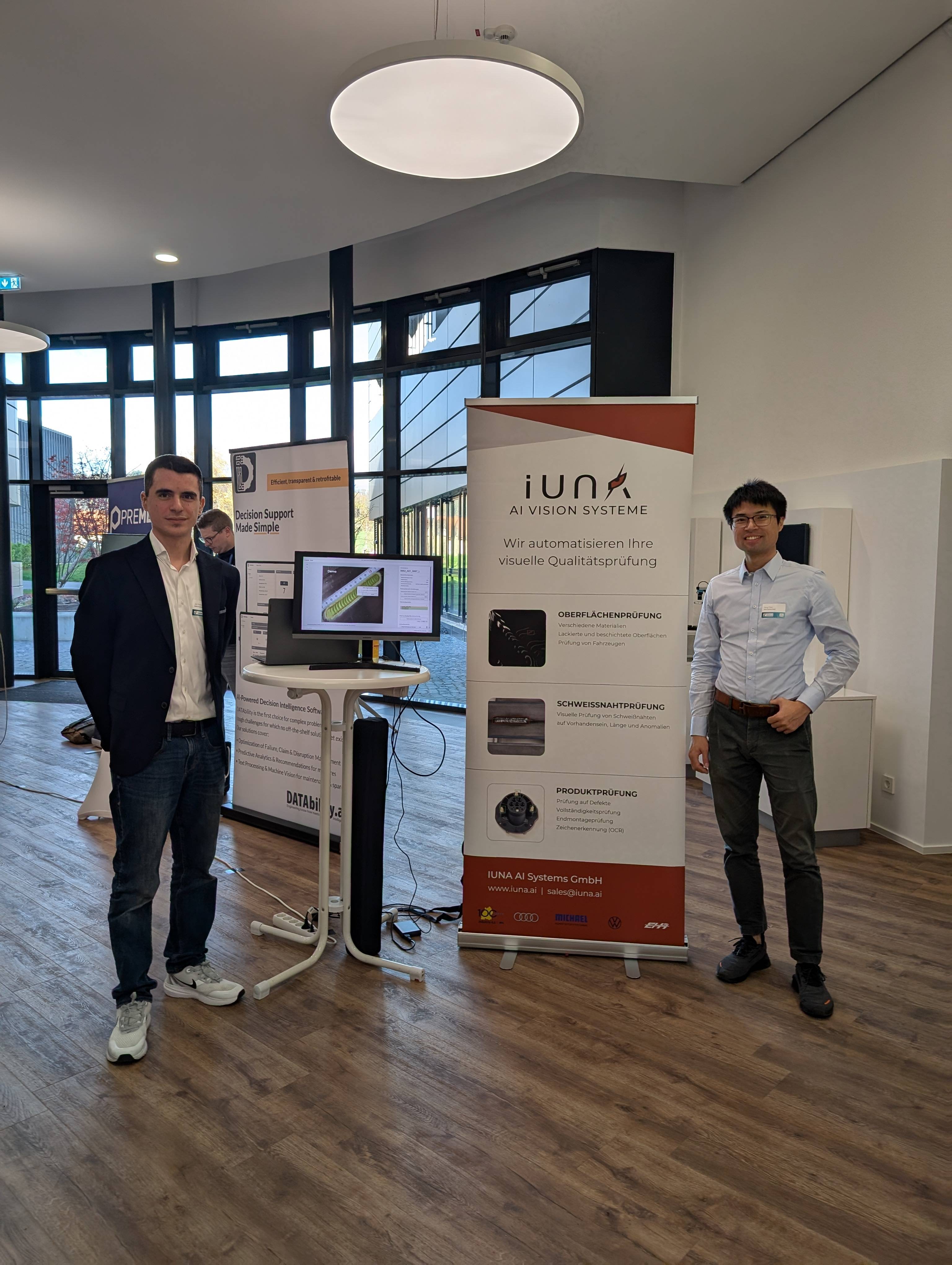 IUNA AI team at an exhibition